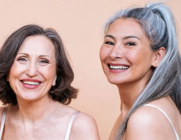 Diverse group of six smiling women of different ages and ethnicities – Innovations Medical homepage background.