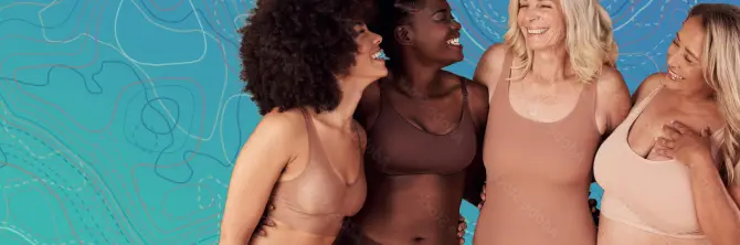 Four women stand together smiling, wearing different shades of neutral-toned underwear, against a blue illustrated background—celebrating confidence and body positivity, inspired by journeys like tummy tuck or cosmetic surgery Texas.