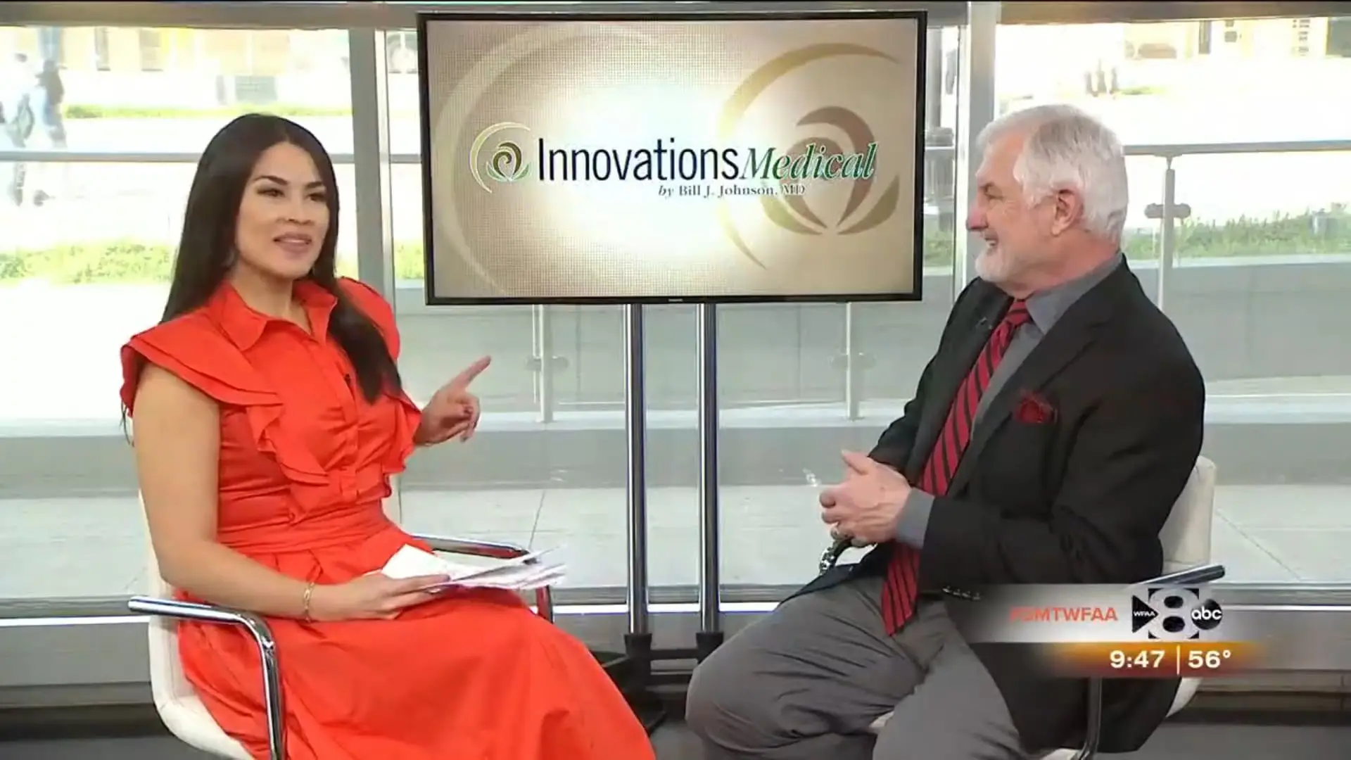 A woman in an orange dress and a man in a black suit and red tie discuss Awake Liposuction in a studio. Behind them, a screen displays “Innovations Medical.” The time, temperature, and channel logo appear at the bottom right.